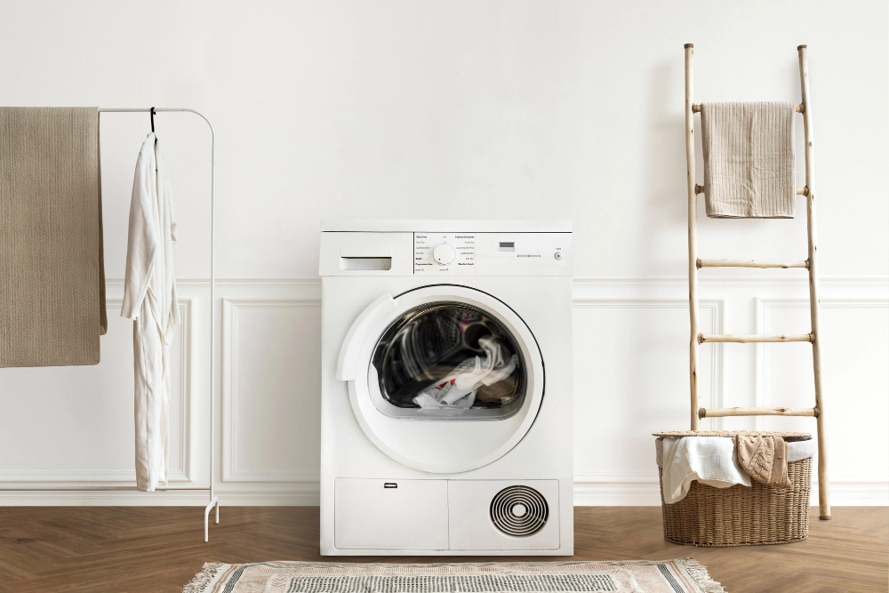 Sèche linge en fonctionnement illustrant l’entretien des vêtements à domicile