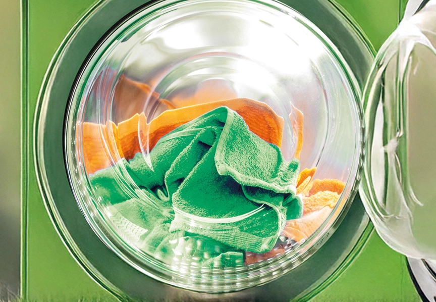 Machine de lavage illustrant les engagements RSE pressing pour un nettoyage plus responsable
